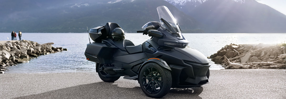 3 wheel motorcycles driving down the street