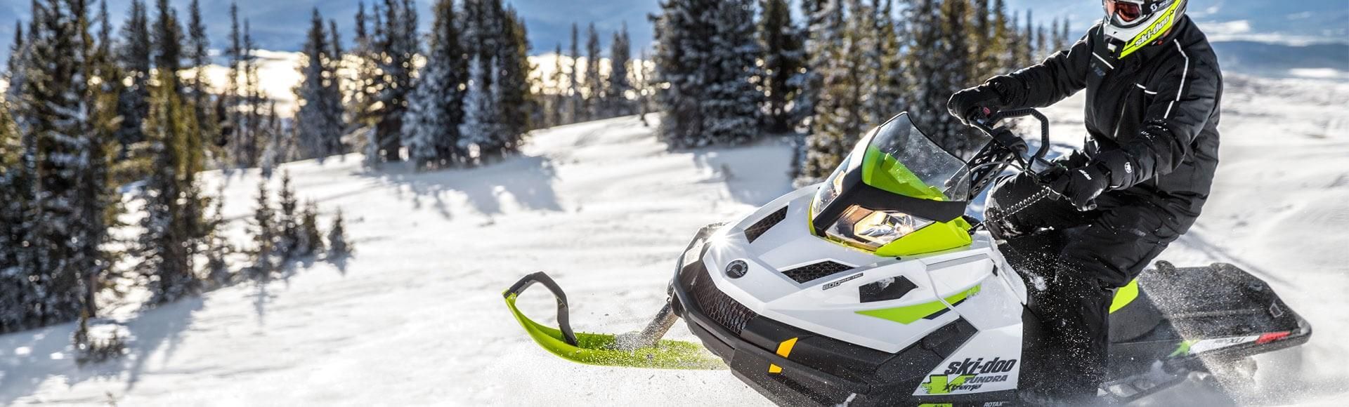 A man riding on a snowmobile